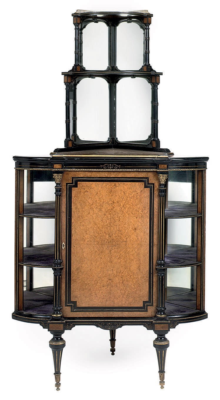 A MID-VICTORIAN GILT-METAL MOUNTED AMBOYNA AND EBONISED PARCEL-GILT ENCOIGNURE
