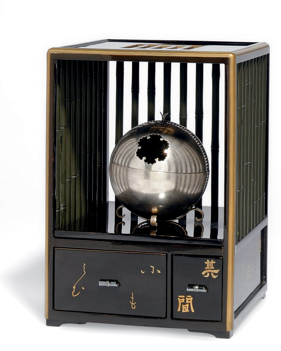 A JAPANESE SILVERED METAL KORO WITH LACQUERED WOOD BOX STAND