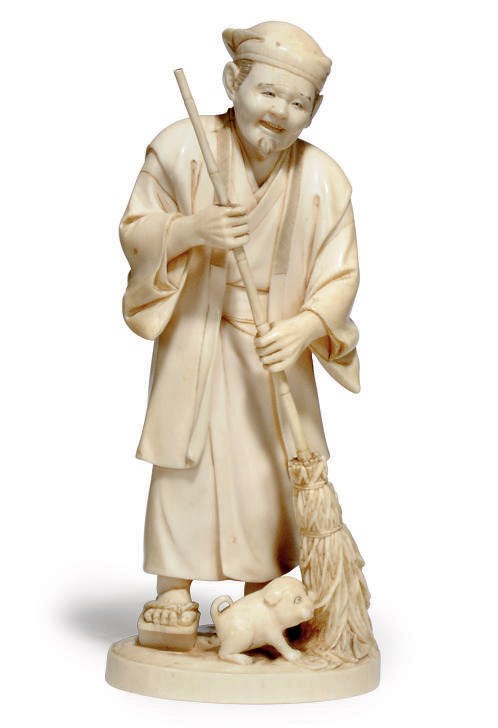 A JAPANESE IVORY OKIMONO GROUP, SIGNED