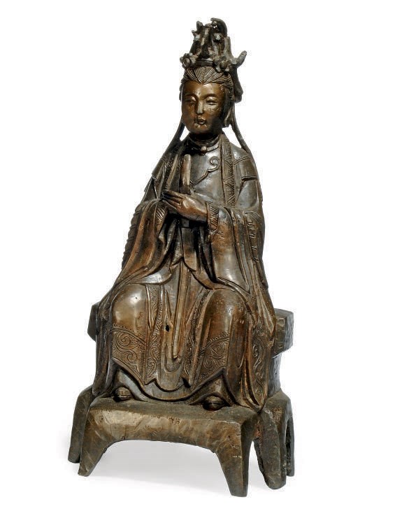 A CHINESE BRONZE MODEL OF GUANYIN