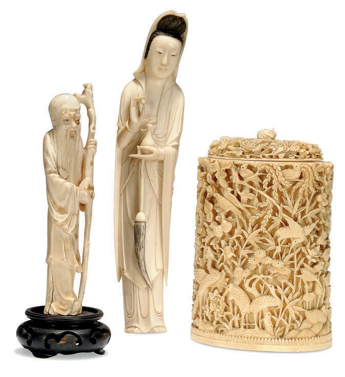 A CHINESE IVORY CYLINDRICAL BOX AND COVER AND TWO FIGURES