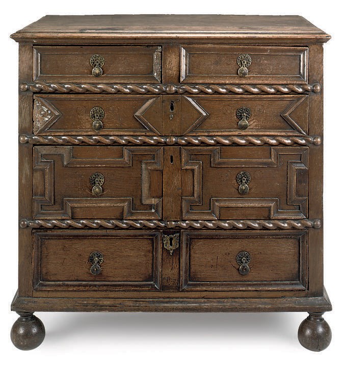 A CHARLES II OAK GEOMETRICALLY MOULDED CHEST