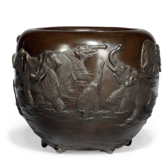 A JAPANESE BRONZE ELEPHANT JARDINIERE