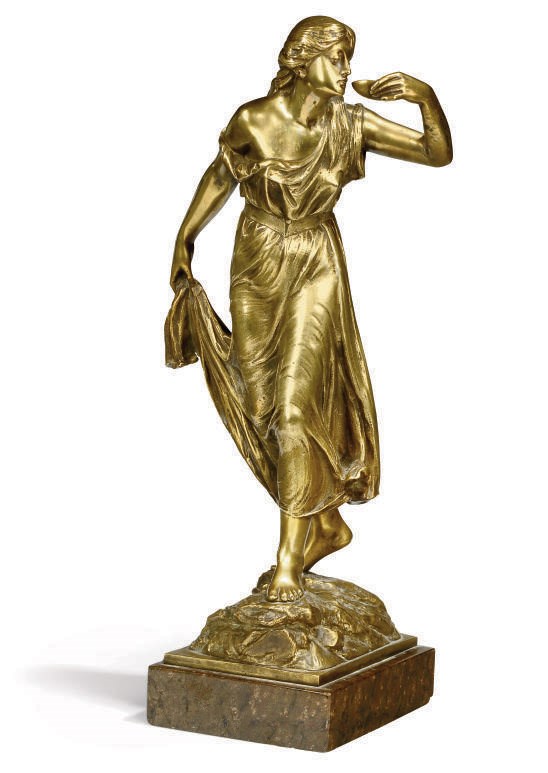 A GERMAN BRONZE FIGURE OF A CLASSICAL WOMAN DRINKING FROM A TAZZA