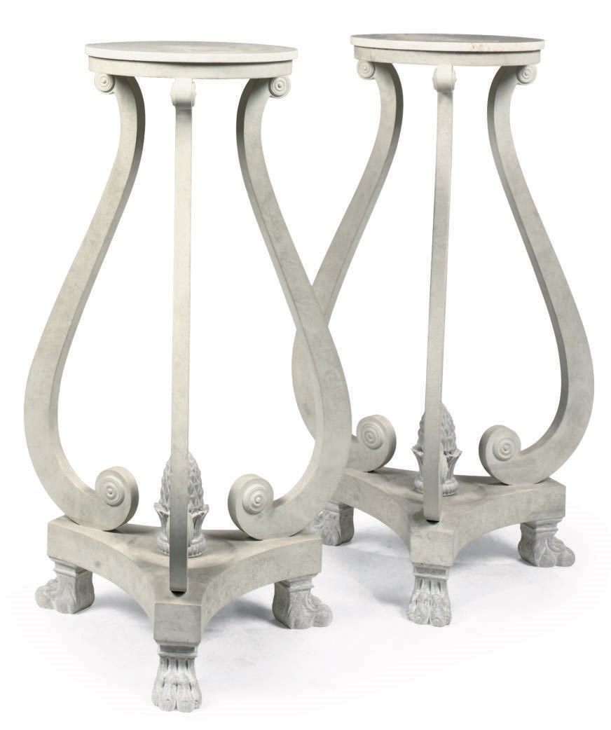A PAIR OF CARVED AND PAINTED URN-STANDS
