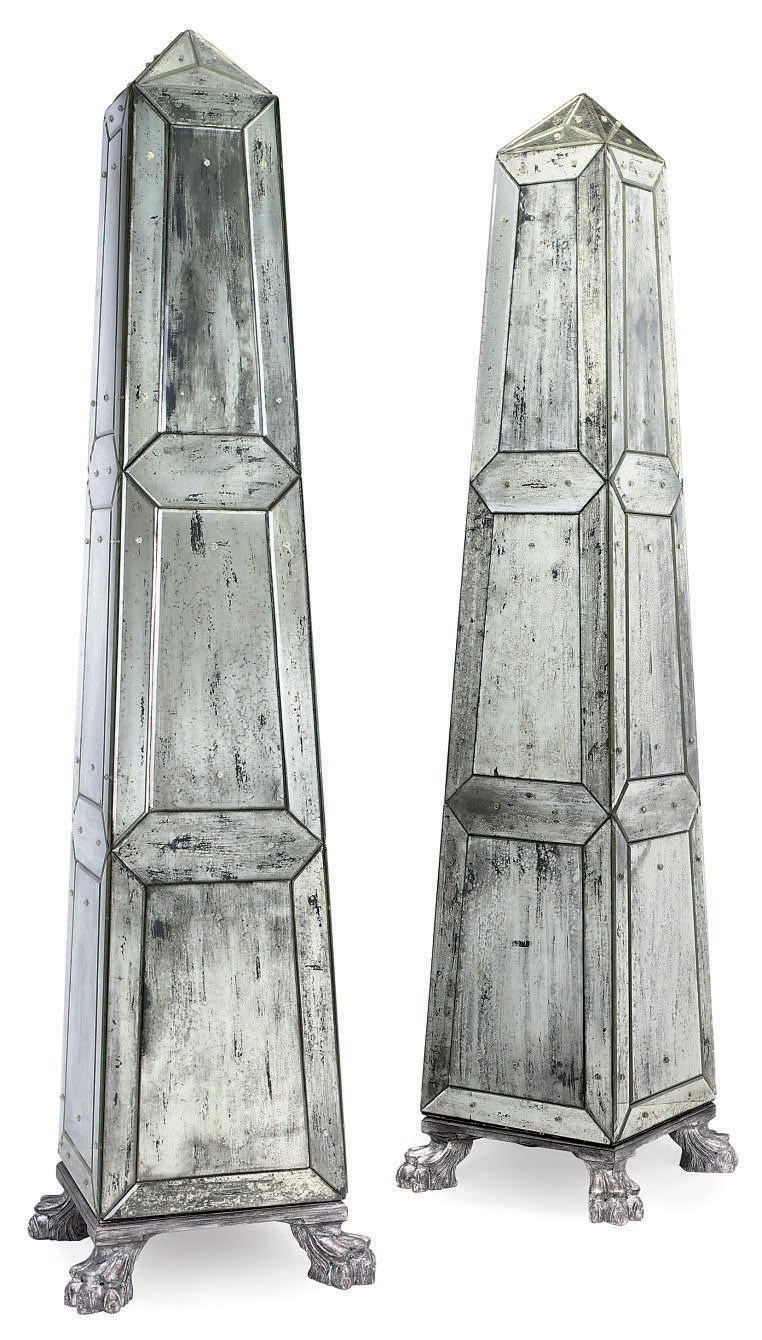A PAIR OF MIRROR GLASS MOUNTED OBELISKS