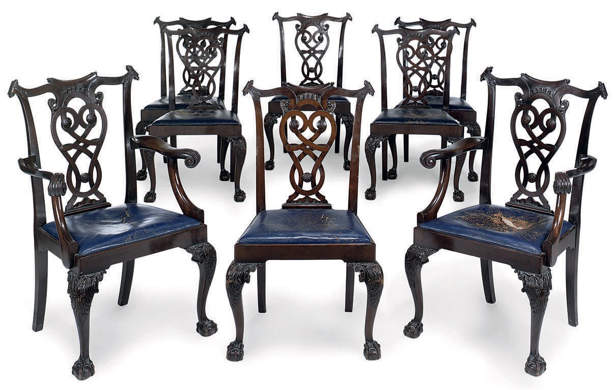 A SET OF EIGHT CARVED MAHOGANY DINING CHAIRS