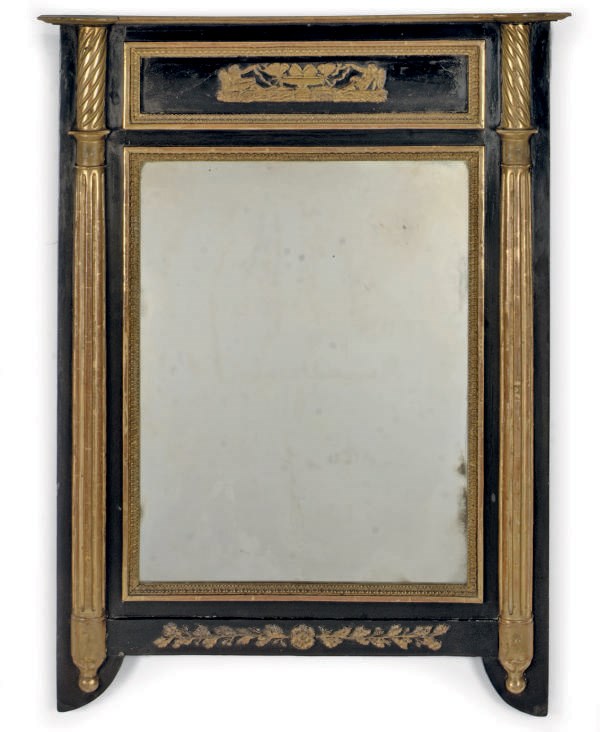A NORTH EUROPEAN EBONISED AND PARCEL-GILT COMPOSITION DECORATED PIER MIRROR
