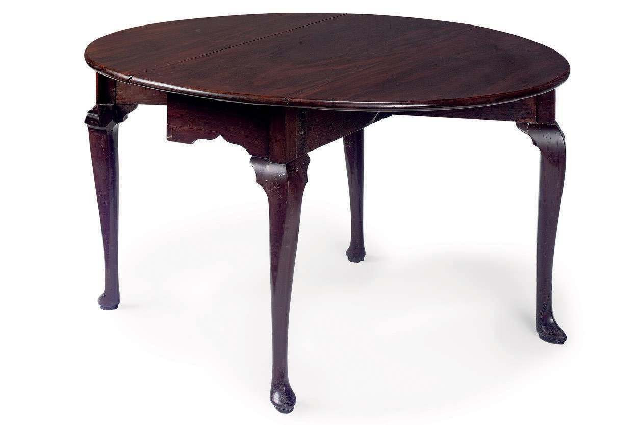 A GEORGE II MAHOGANY DROP-LEAF TABLE