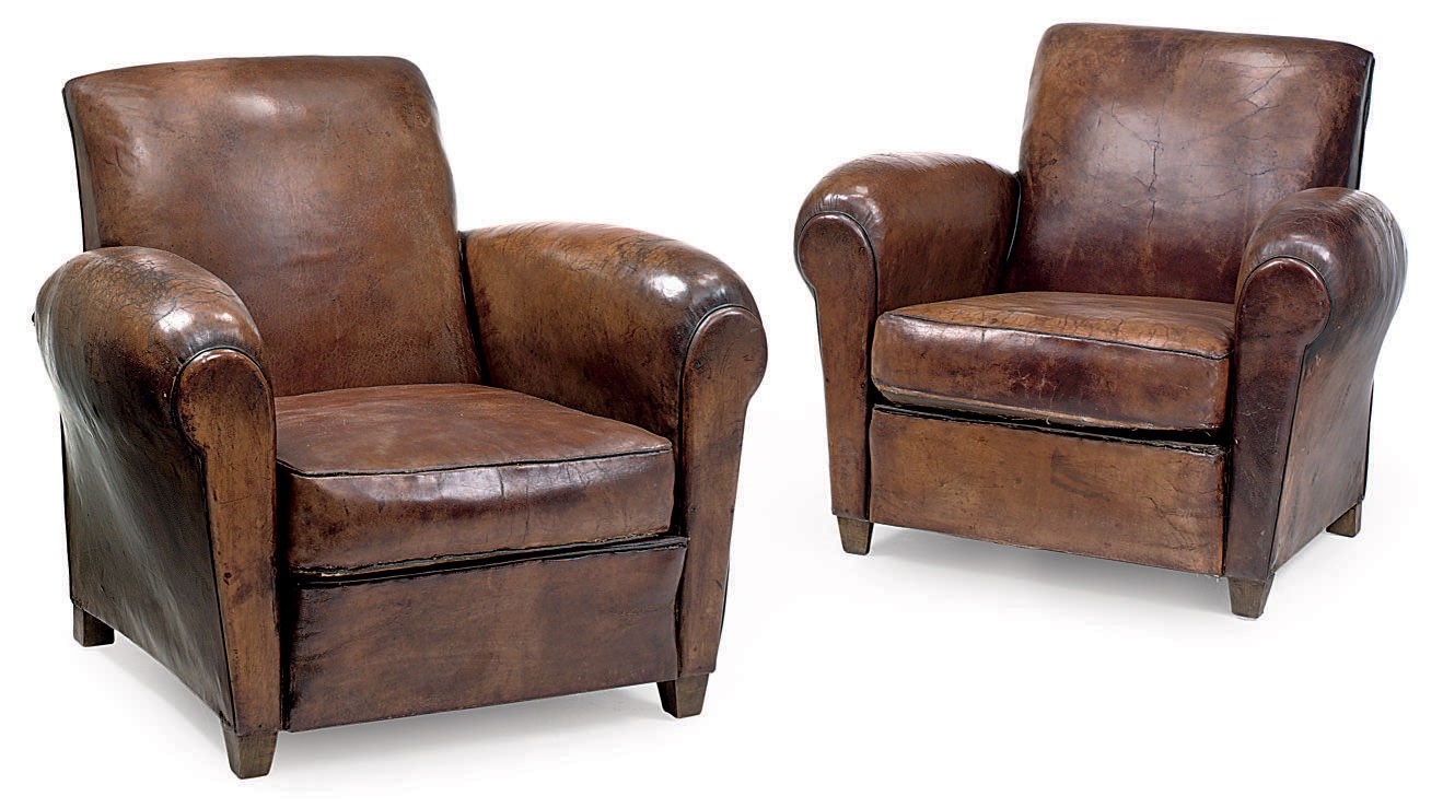 A PAIR OF LEATHER UPHOLSTERD BEECH CLUB ARMCHAIRS