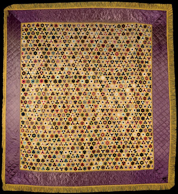 A 'GRANDMOTHER'S FLOWER GARDEN' QUILT