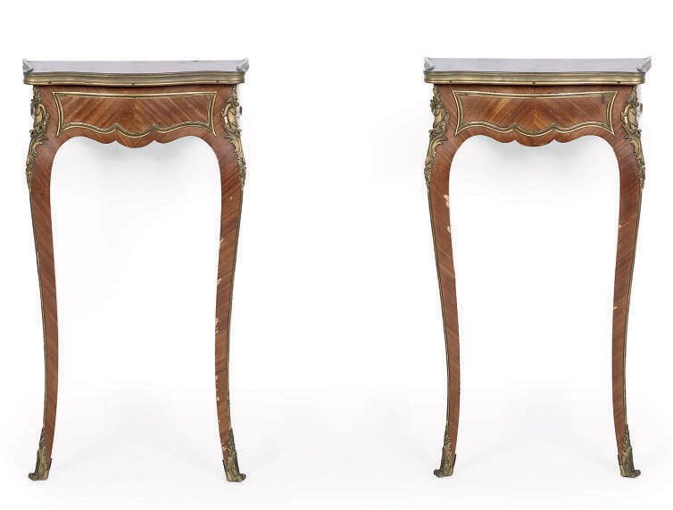 A PAIR OF MAHOGANY AND GILT METAL MOUNTED CONSOLE TABLES