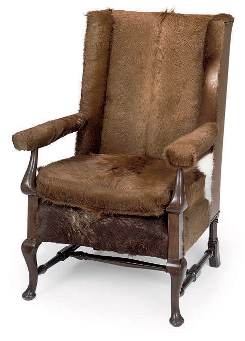 A MAHOGANY WING CHAIR