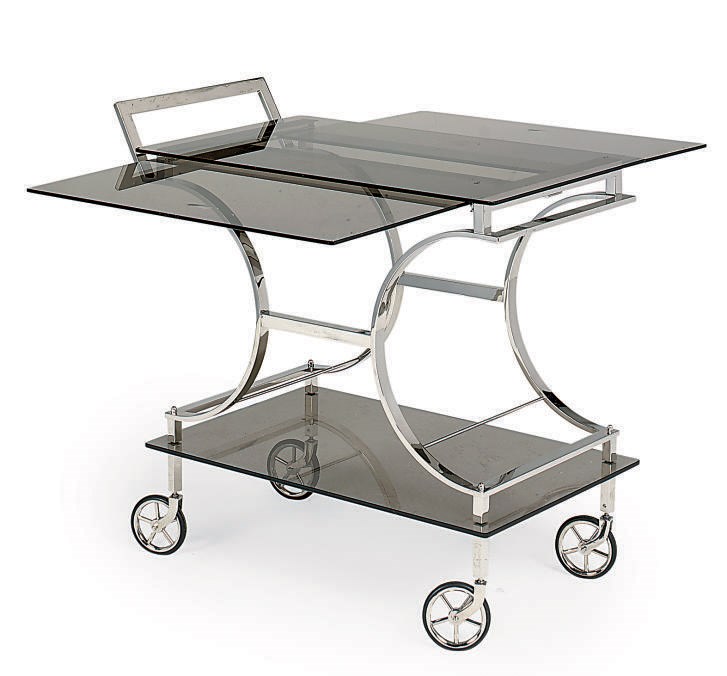 A CHROME-PLATED AND SMOKED GLASS SERVING TROLLEY
