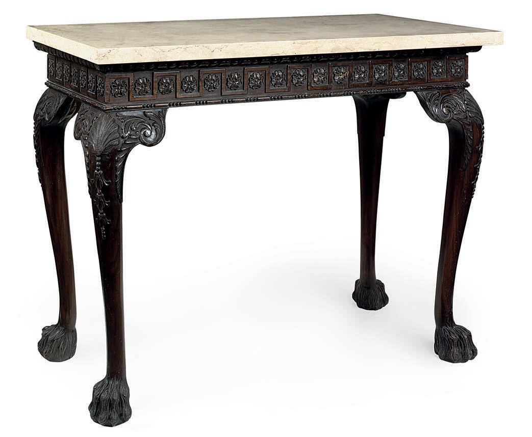 A CARVED MAHOGANY CONSOLE TABLE