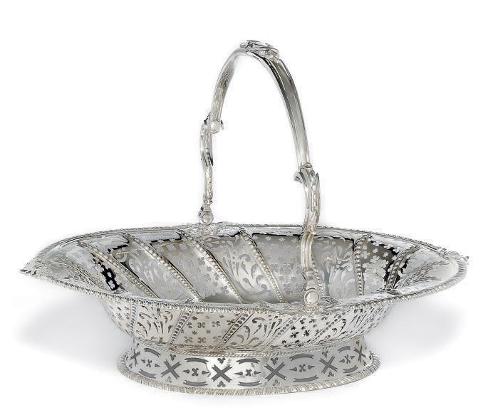 A GEORGE III OVAL SILVER SWING-HANDLED CAKE BASKET