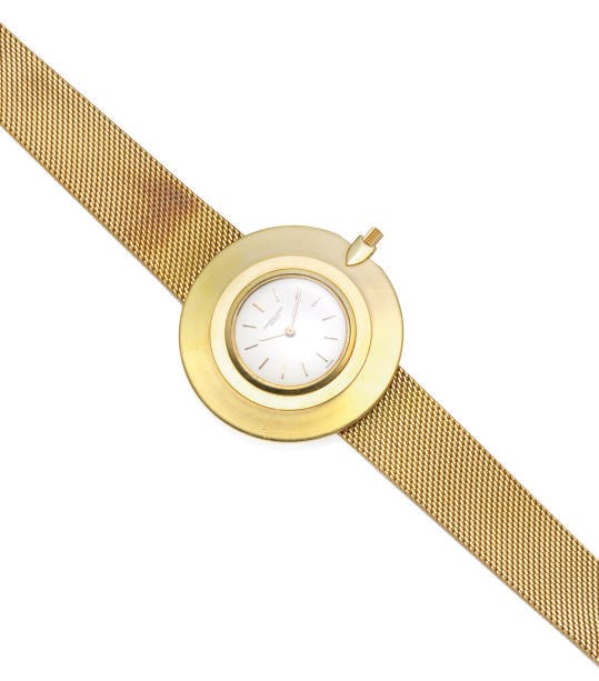 AN 18K GOLD UNLTRA-THIN WRISTWATCH WITH OVERSIZED BEZEL, BY AUDEMARS PIGUET