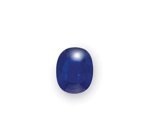 AN UNMOUNTED OVAL-SHAPED CABOCHON SAPPHIRE