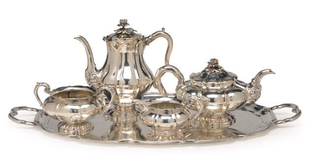 AN ASSEMBLED ENGLISH FOUR-PIECE TEA SERVICE AND A TWO-HANDLED TEA TRAY,