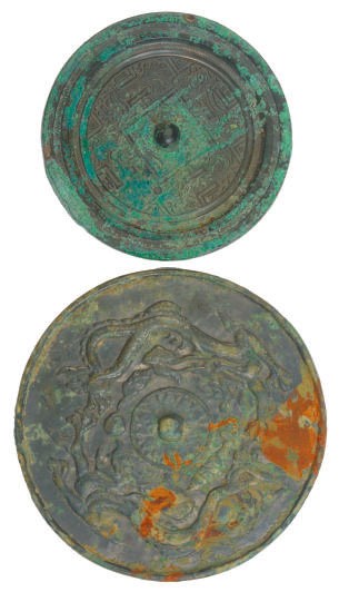 A CHINESE BRONZE MIRROR,