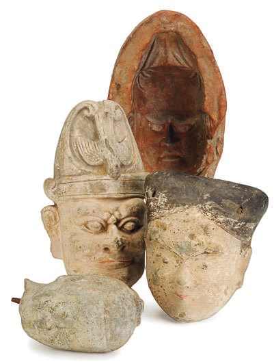 THREE CHINESE PAINTED POTTERY HEADS AND A MOLD FOR A HEAD,
