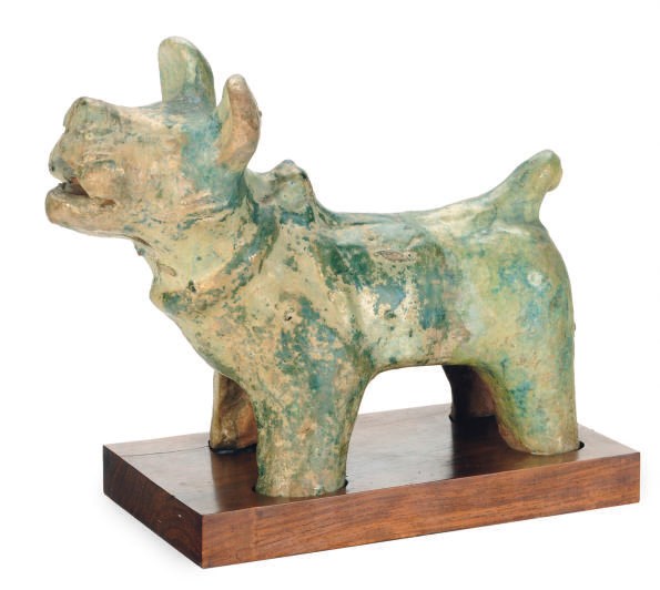 A CHINESE GREEN-GLAZED POTTERY FIGURE OF A DOG,