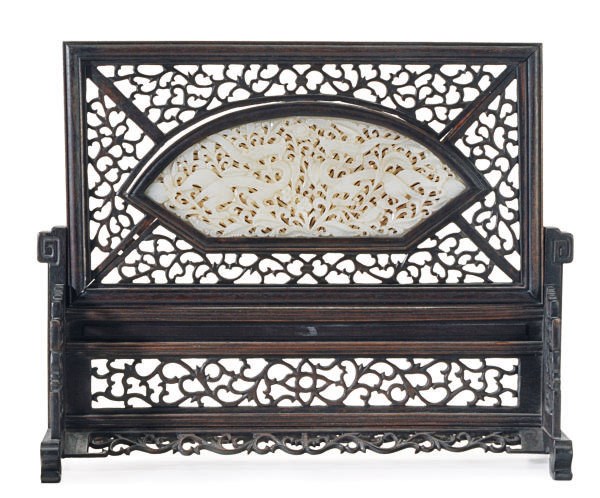 A CHINESE WHITE JADE PIERCED PLAQUE MOUNTED AS A WOOD TABLE SCREEN,