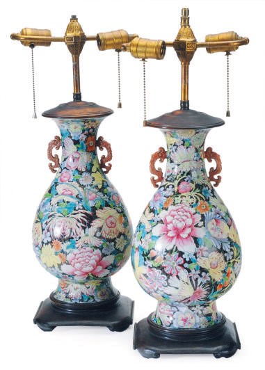 A PAIR OF CHINESE FAMILLE ROSE BLACK-GROUND PORCELAIN PEAR-SHAPED VASES MOUNTED AS LAMPS