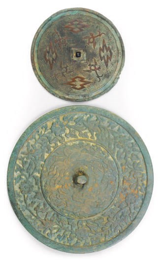 A KOREAN BRONZE MIRROR AND A CHINESE BRONZE MIRROR,
