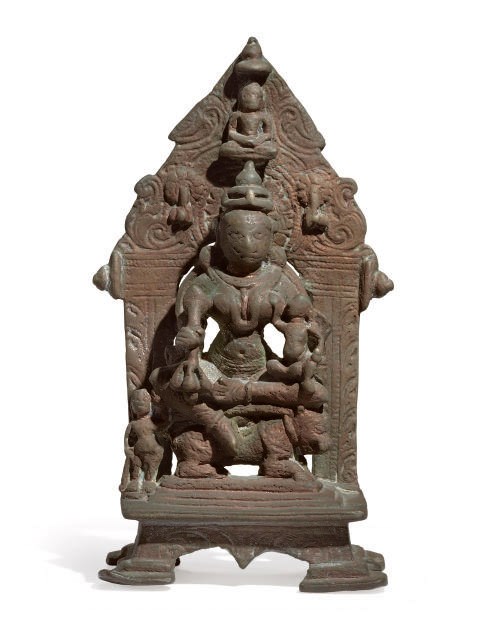 AN INDIAN BRONZE FIGURE OF AMBIKA,