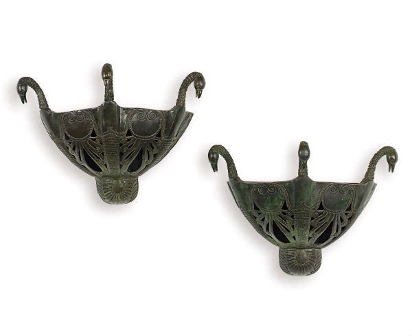 A PAIR OF GREEN-PATINATED BRONZE TRIPLE-SWAN FORM WALL APPLIQUES,