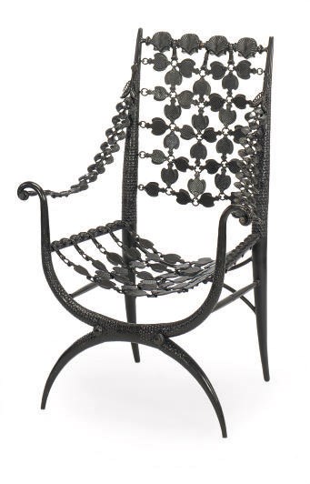 A PATINATED BRONZE ARMCHAIR,