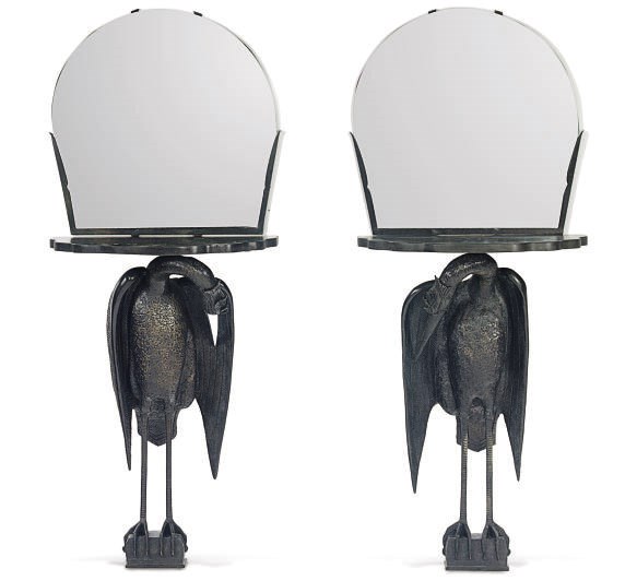 A PAIR OF PATINATED BRONZE AND MIRRORED FIGURAL CONSOLES,