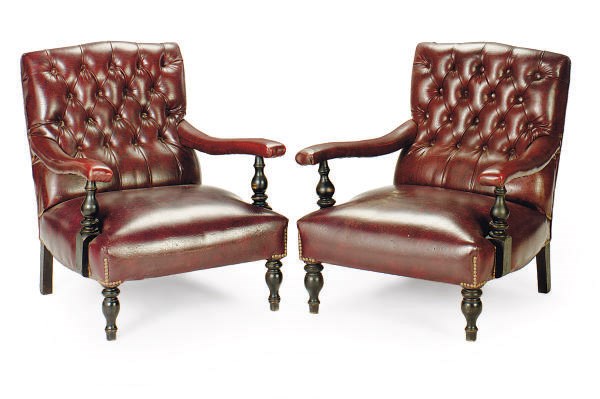 A PAIR OF EDWARDIAN EBONIZED AND UPHOLSTERED LIBRARY CHAIRS,