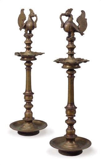 A PAIR OF INDIAN BRASS OIL LAMPS,