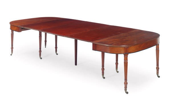 A REGENCY MAHOGANY EXTENDING DINING TABLE,