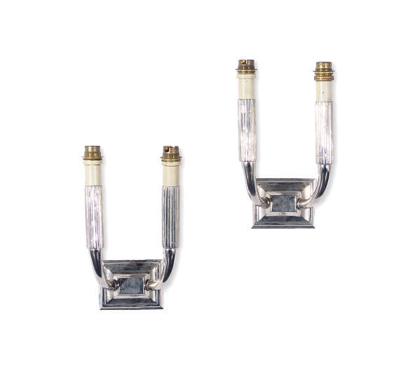 A PAIR OF SILVERED-METAL TWO-BRANCH WALL-LIGHTS,