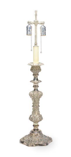 A SILVERED METAL CANDLESTICK LATER MOUNTED AS A LAMP,