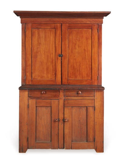 A STAINED PINE AND FRUITWOOD CORNER CUPBOARD,