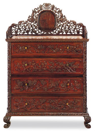 A HARDWOOD CHEST-OF-DRAWERS,