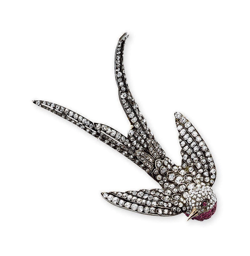 AN ANTIQUE DIAMOND AND RUBY SWALLOW BROOCH