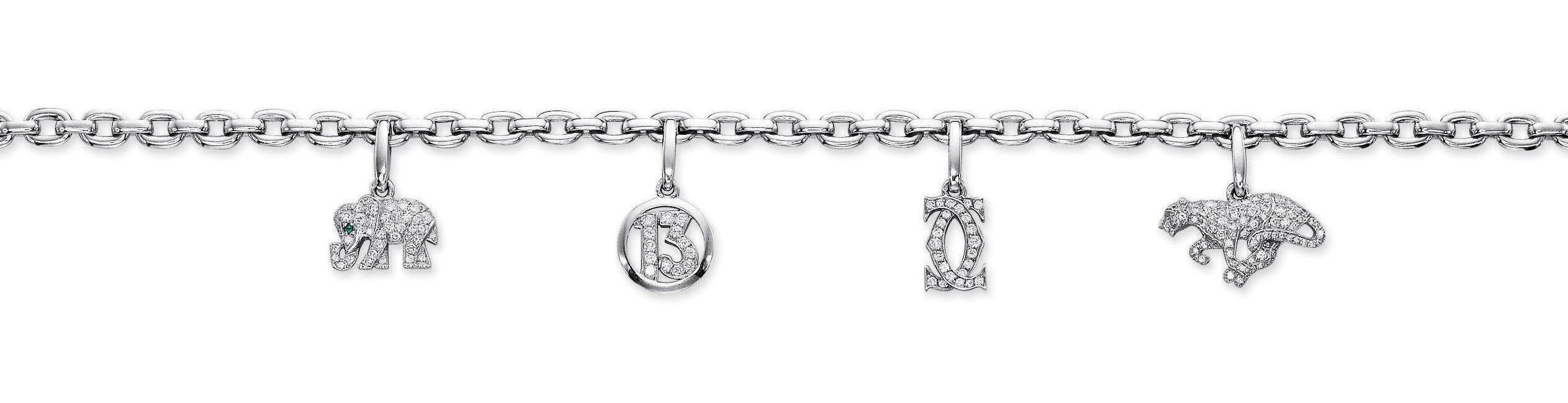 A DIAMOND CHARM NECKLACE, BY CARTIER