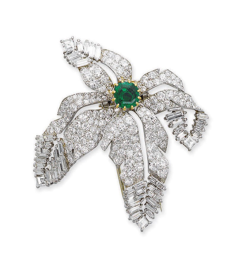AN EMERALD AND DIAMOND CLIP BROOCH, BY CARTIER