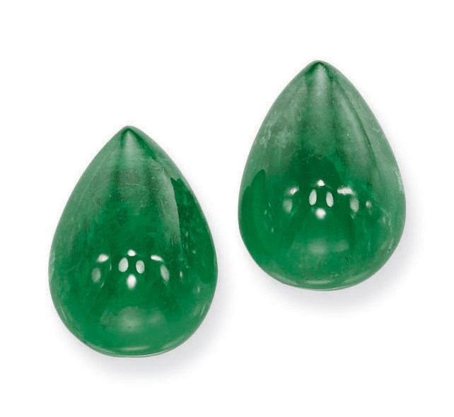 A PAIR OF UNMOUNTED EMERALDS