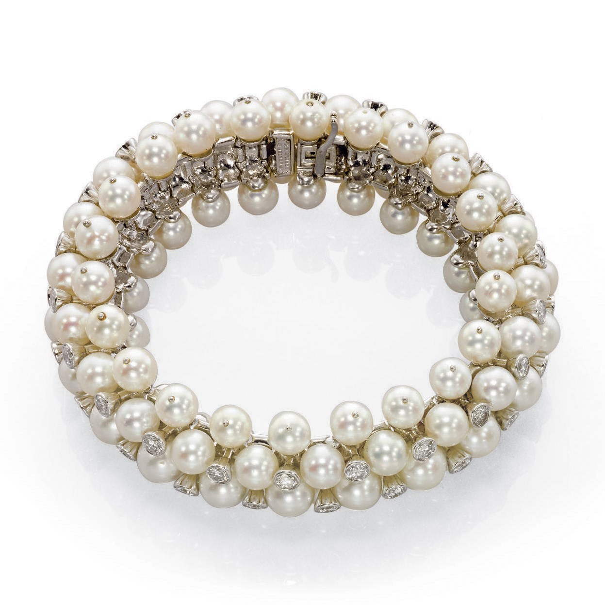 AN ATTRACTIVE CULTURED PEARL AND DIAMOND BRACELET, BY VAN CLEEF & ARPELS