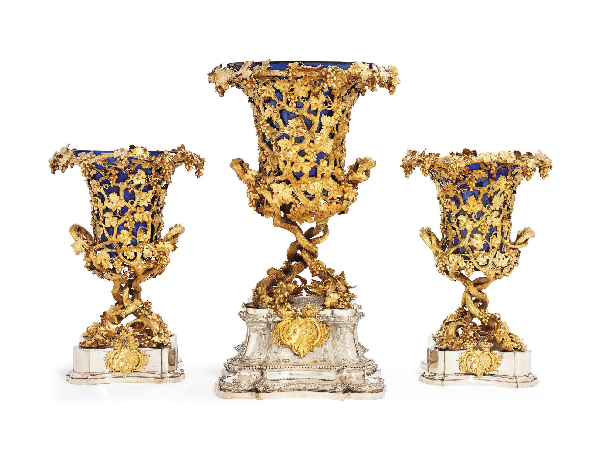 A SET OF THREE VICTORIAN SILVER AND SILVER-GILT VASES