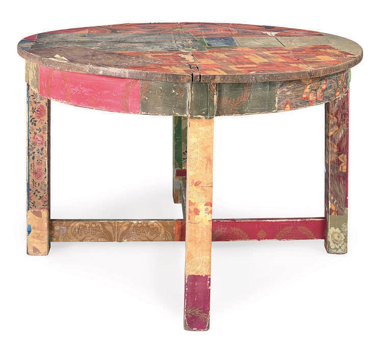 A WALLPAPER COVERED CENTER TABLE