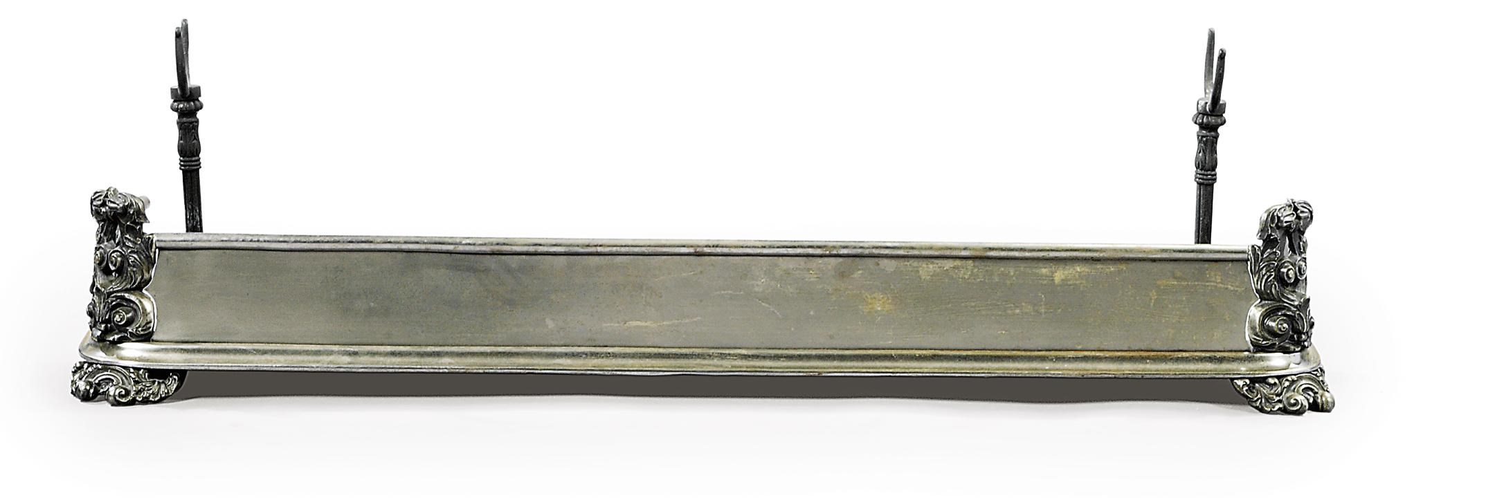 AN EARLY VICTORIAN STEEL AND IRON FENDER