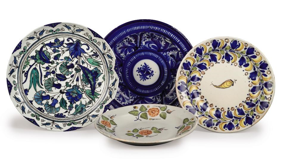 A FRENCH PORCELAIN ISNIK-STYLE CHARGER AND THREE CONTINENTAL FAIENCE DISHES