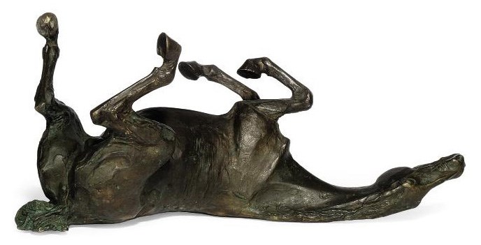 A BRONZE MODEL OF A HORSE